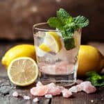 Himalayan Salt Detox Drink Recipes : Weight Loss Slim Down & Feel Amazing 12 Himalayan Salt Detox Drink Recipes – Refreshing glass of Himalayan salt detox water with lemon slices, mint leaves, and pink salt crystals.