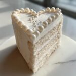white heart cake with pearls